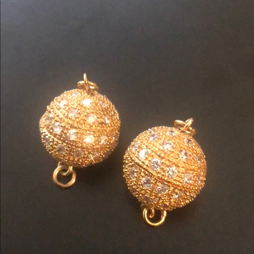 Necklace clasps with gold and crystal designs